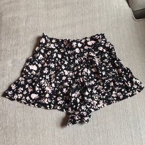 Floral black and pink flowy shorts with pockets.